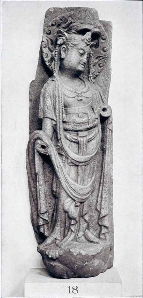 Stone bas relief of a bodhisattva on a lotus pedestal with arms broken off at the elbow