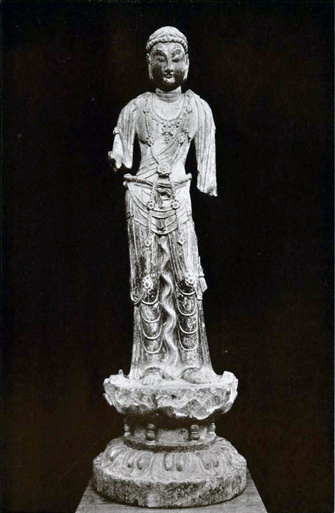 Stone statue of a Bodhisattva with clothing garb, arms missing from the elbows down