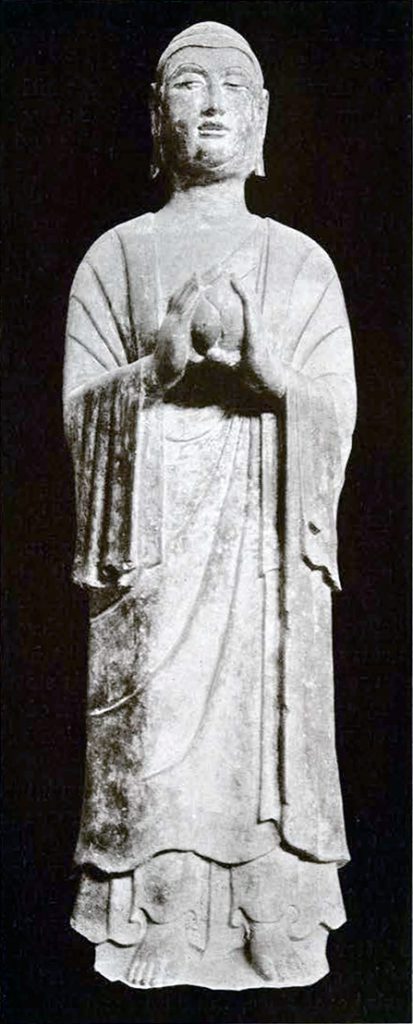 Stone statue of Pratyekabuddha, holding a lotus bud
