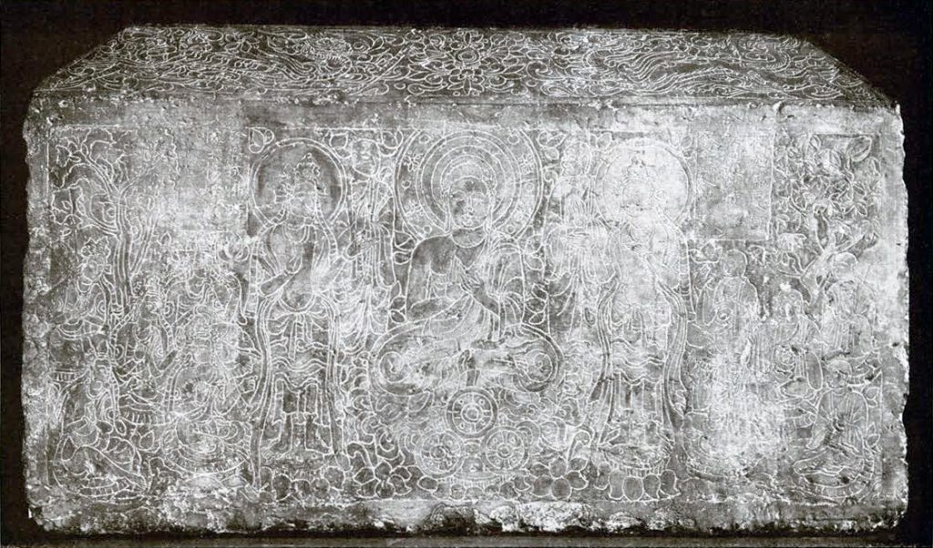 Four sided stone pedestal inscribed on each side with scenes from life of the Buddha, this side shows the Buddha giving a sermon to ascetics, shown as monks before and bodhisattvas after