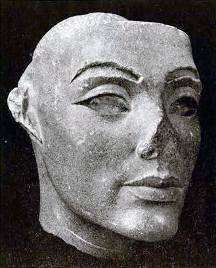 Large stone head with nose missing