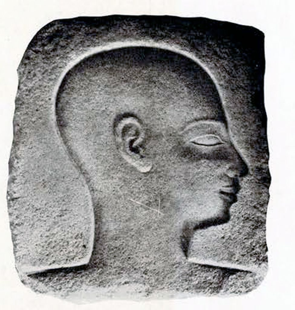 Relief of a man in profile with head shaved