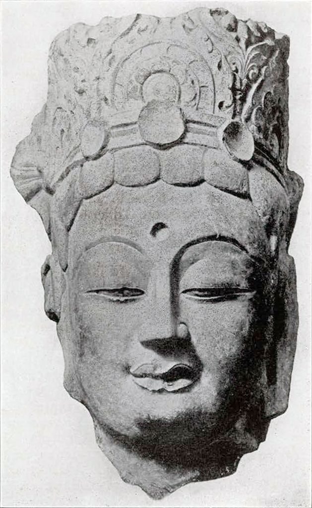 Colossal head of a Bodhisattva with a urna with plaited hair and elaborate crown