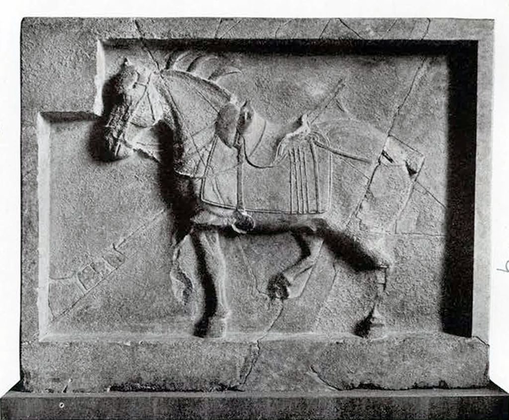 Limestone bas relief of Curly defying his nine arrow wounds and marching on