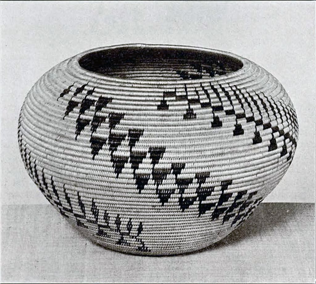 Round woven bowl-shaped basket with triangular and line patterns