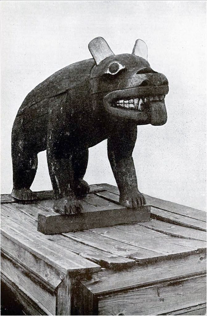 A wooden blackbear figure with its tongue out