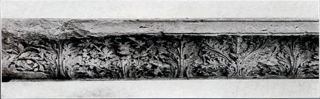 Stone with a carved leaf motifz