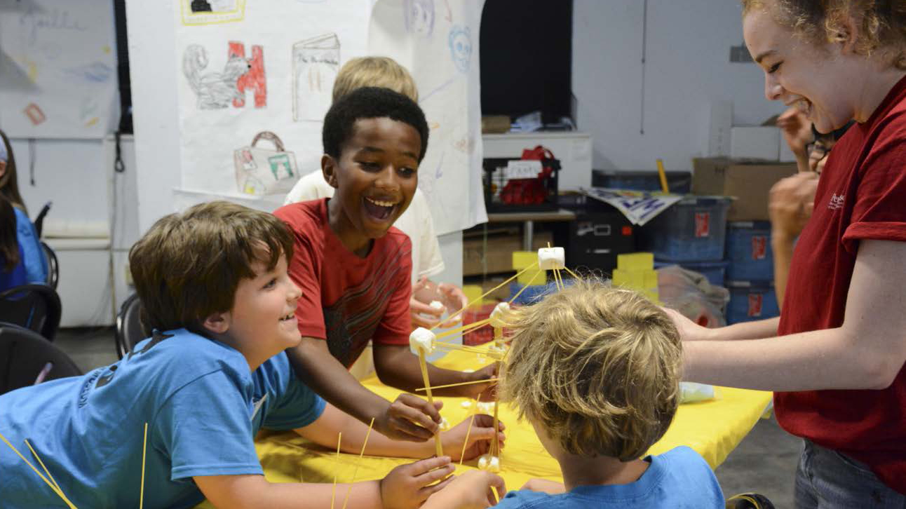Children building with spaghetti and marshmallows at Penn Museum Anthropology Camp