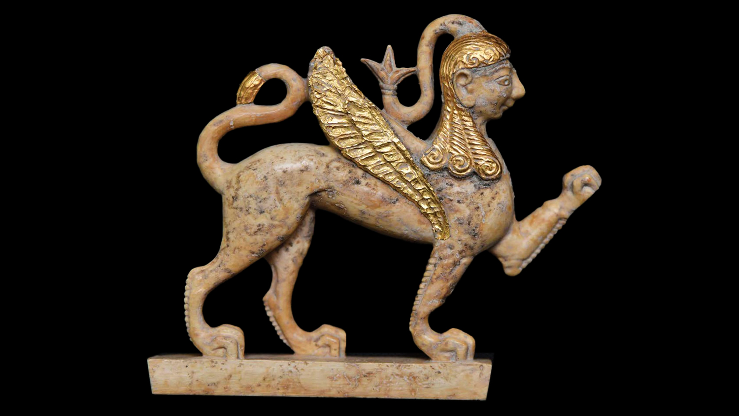 Gold and ivory sphinx.