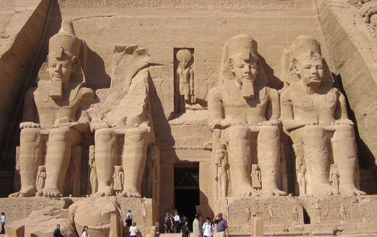 Entrance to a monument in Lower Nubia, with massive statues of seated pharaohs. 