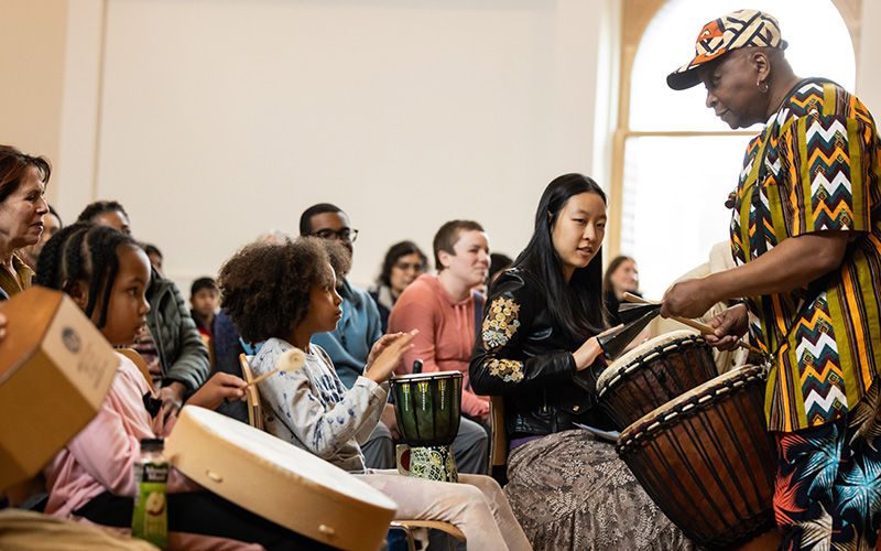 Students learning to play the drums.