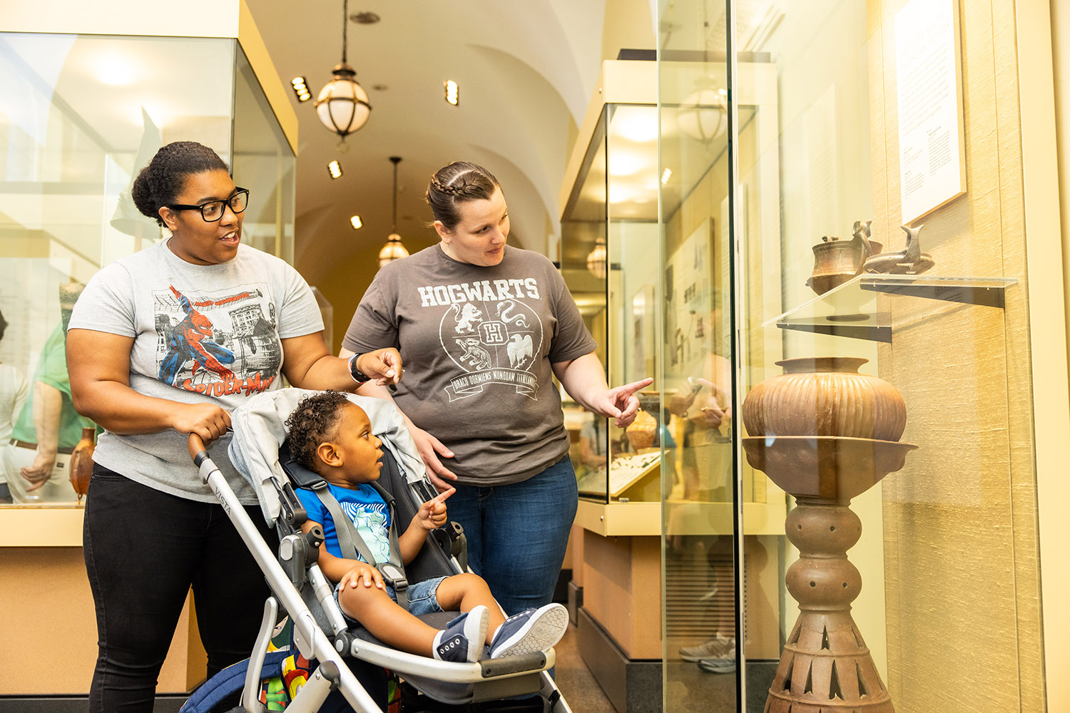 Visitors looking at a museum display.