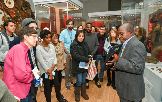 A Global Guide leading a tour in the Africa Galleries.