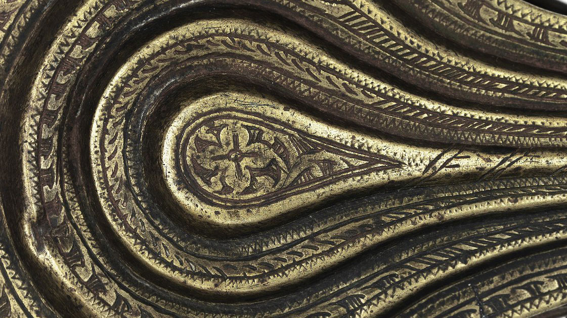 Close up of the carved contours of an instrument.