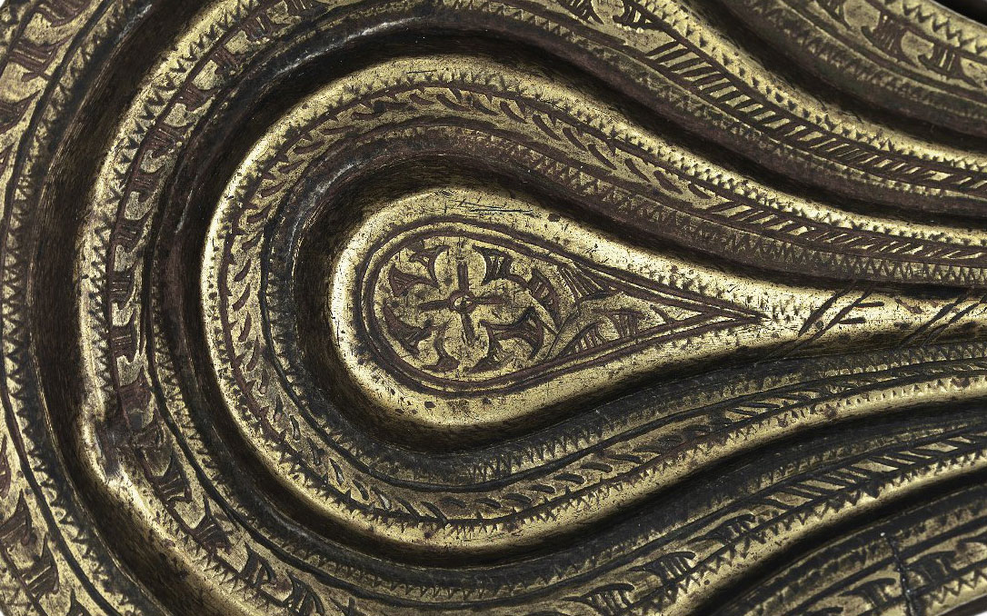 Close up of the carved contours of an instrument.