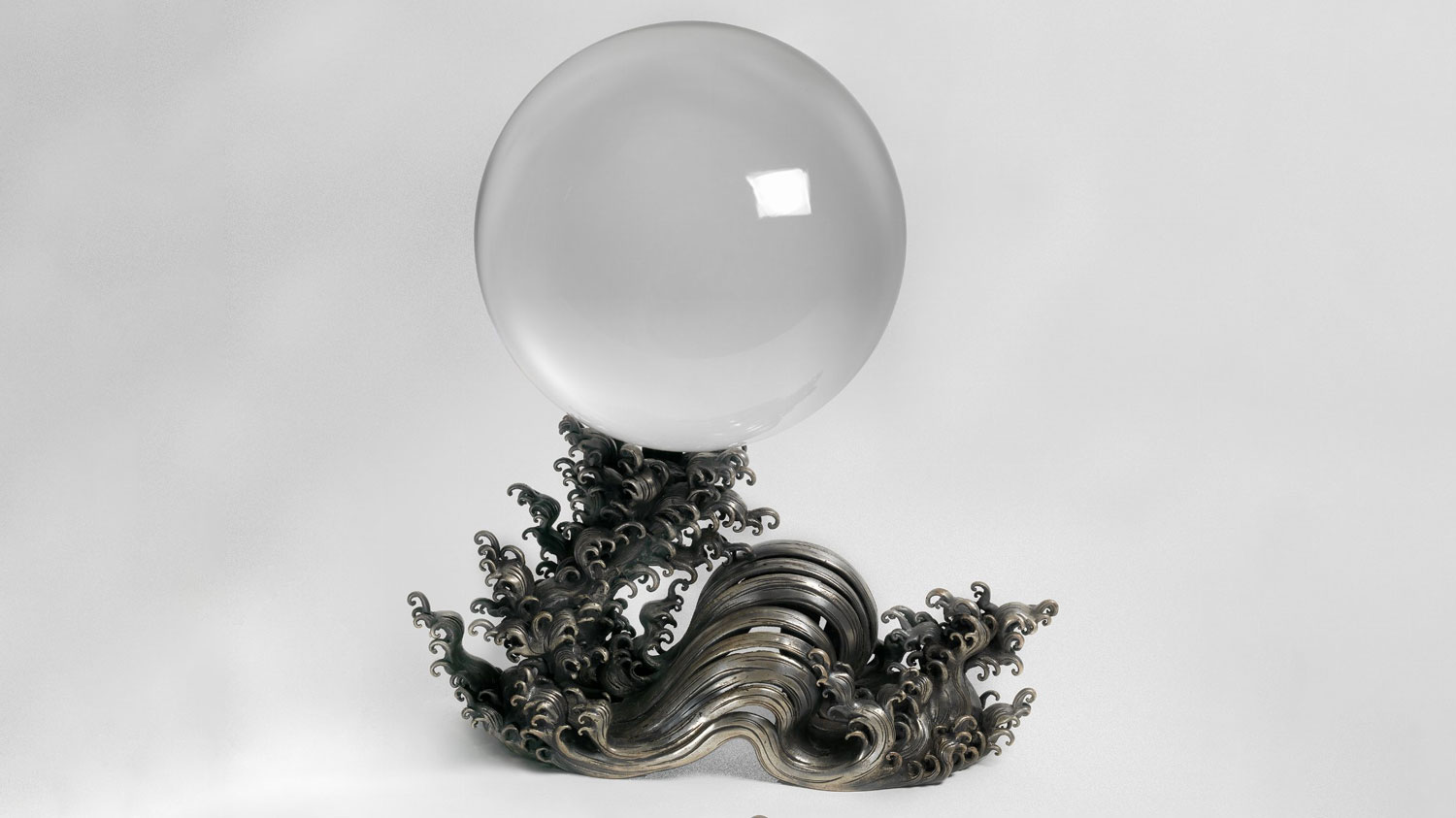 Crystal Ball and silver wave stand.