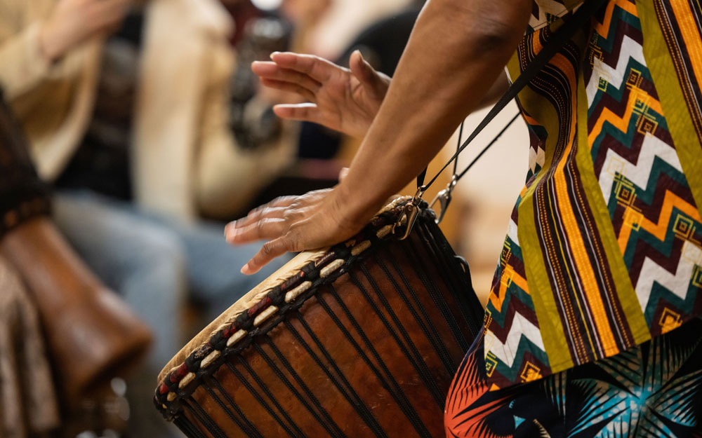 Close up of hands drumming.