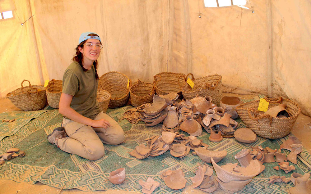 Fellow with a variety of pottery sherds.