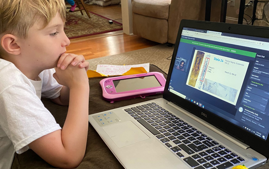 A young child participating in a virtual playdate