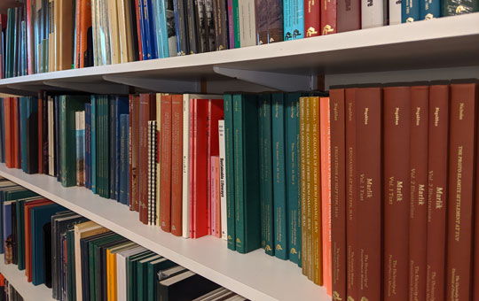 A row of books on a shelf.