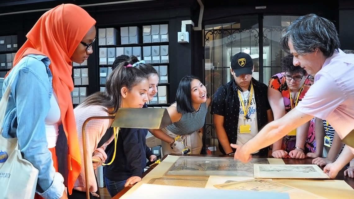 teen summer interns get a tour of museum archives by senior archivist Alessandro Pezzati