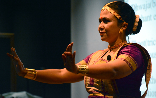 A woman performing a dance on stage