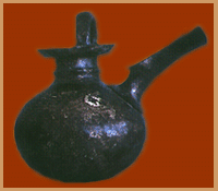 Jug with long, sieved spout