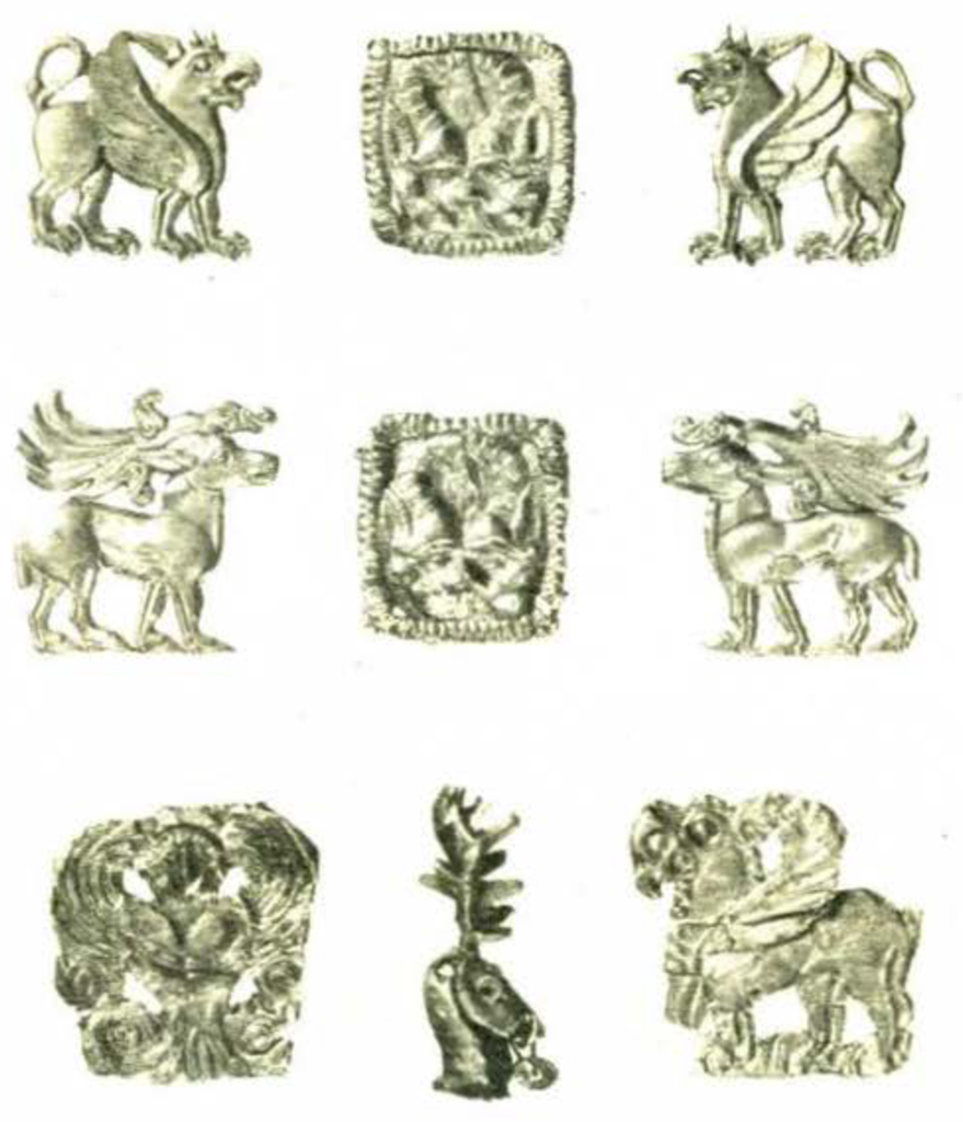 Nine small charms and plaques showing animals in repousée