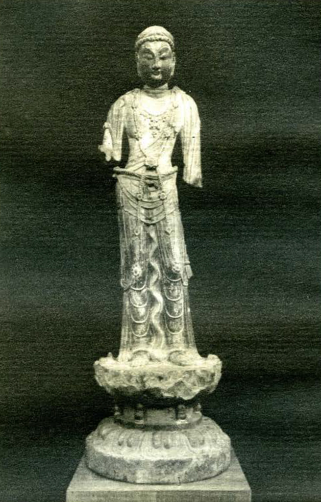 Small statue of a bodhisattva dressed in flowing robes, lower portions of both arms missing
