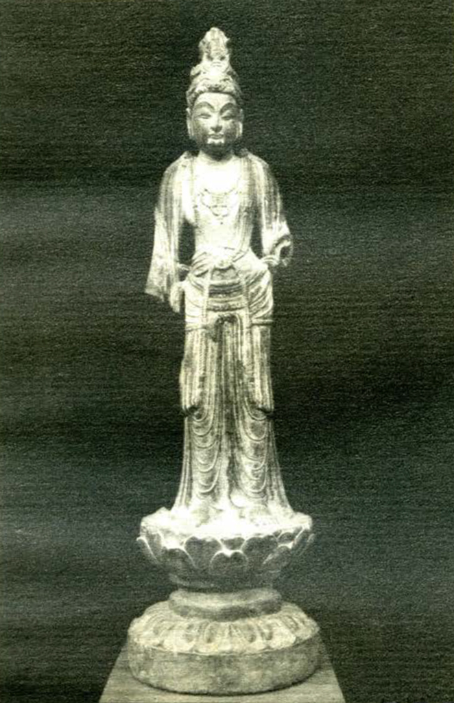 Small statue of a bodhisattva dressed in flowing robes with a patra headdress, lower portion of both arms missing