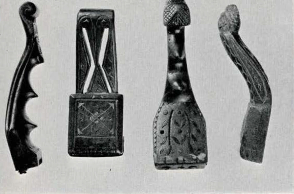 Four wood splint strippers with decorated designs carved into them
