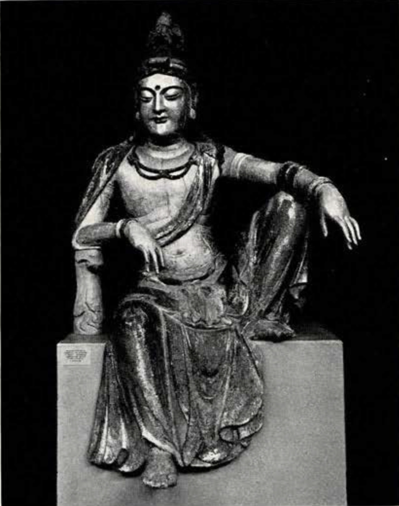 Gilt statue of Guanyin in the royal ease pose, with one leg pendant and a bent knee against the ledge
