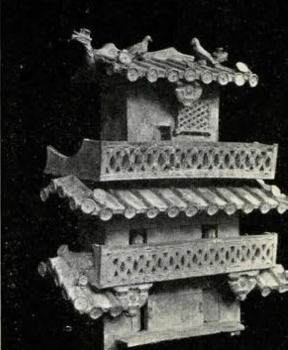 Pottery model of a Han house or watch tower with three stories and birds on the roof