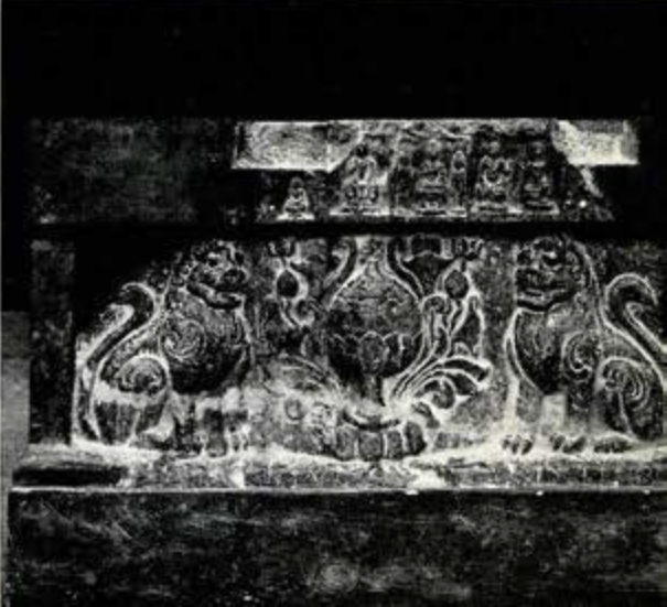 Stone carved altar frontal with relief carving of an incense burner between two seated lions