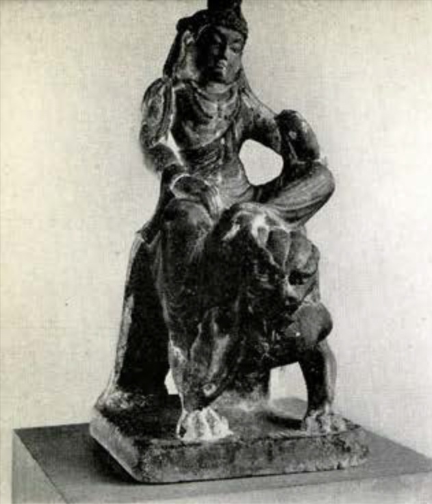 Statue of a Bodhisattva of wisdom riding a lion in the royal ease position