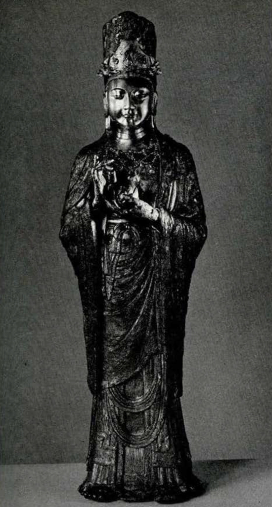 Gilt bronze statue of Guanyin holding a lotus flower with tall headdress