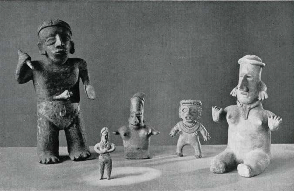 Several pottery figures, standing and sitting, of various sizes