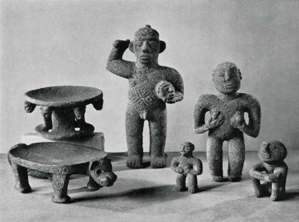 Four carved stone figurines and two stone stands
