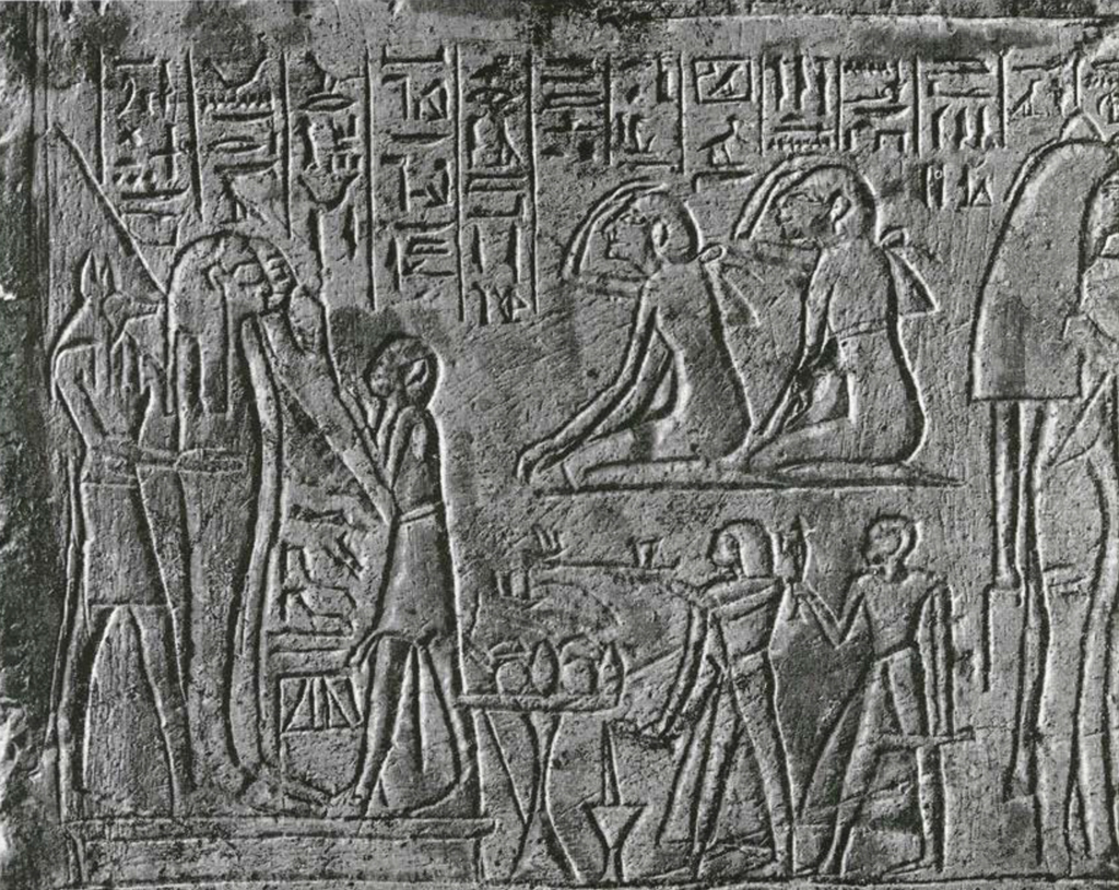Close up of a funerary stela showing the funerary service and mourners in front of a coffin