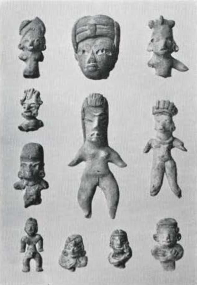 Many small figurines of figures, some full bodies, some just heads and shoulders