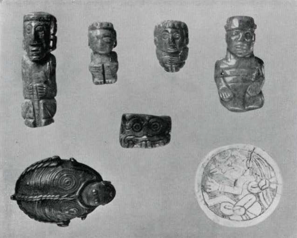 Several small carved human figures, a bell in the shape of a turtle, and an engraved shell disk 