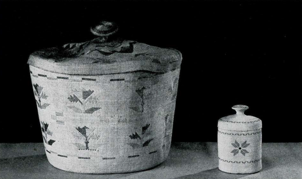 Two woven baskets with flower designs with button shaped handles