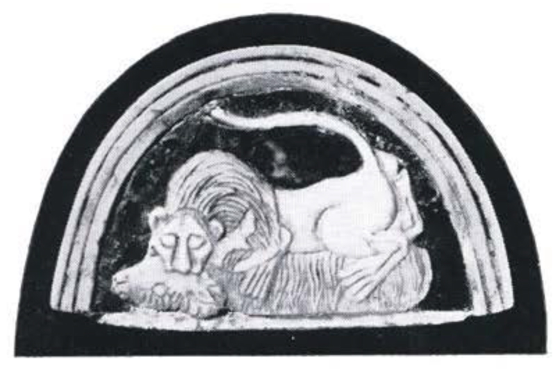Inlay of a lion biting a ram