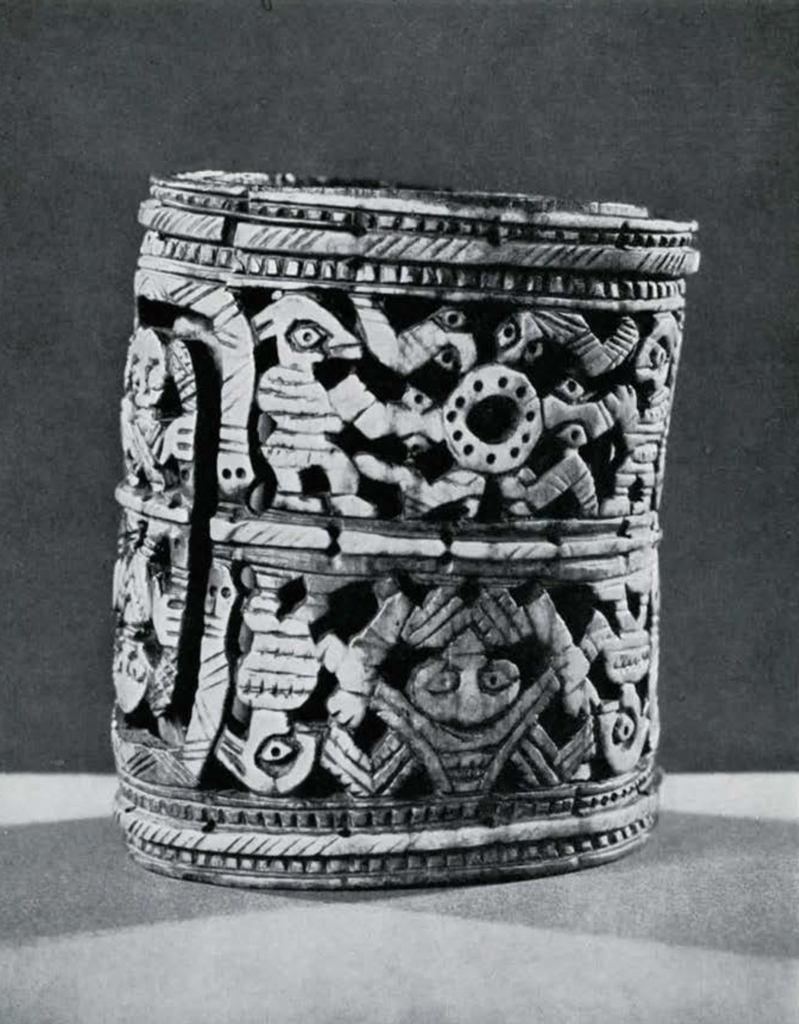 Carved ivory armlet with two registers of decoration