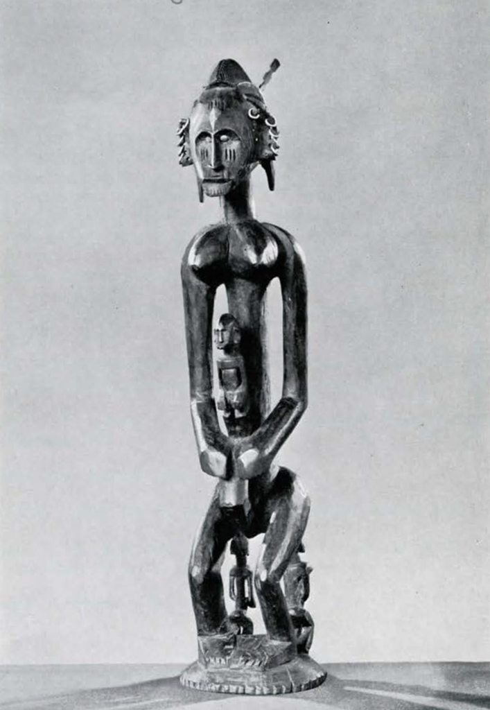 Stylized wooden statuette of a woman