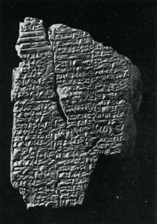 A tablet with pieces missing, inscribed in cuneiform
