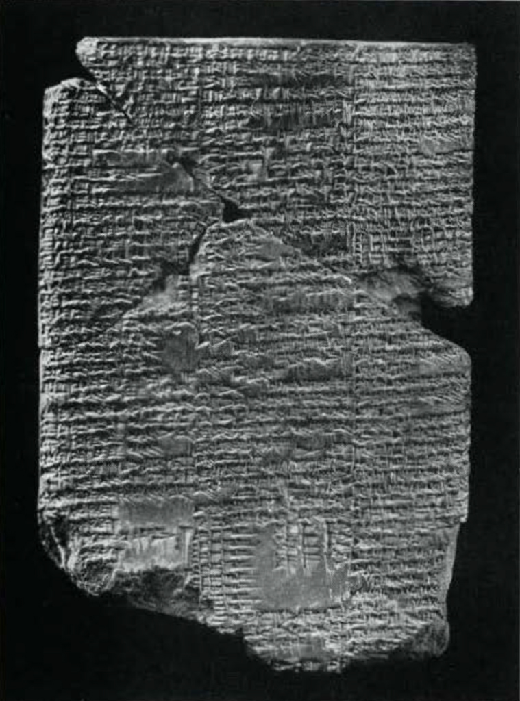 Several pieces of a tablet pieced together to show inscription
