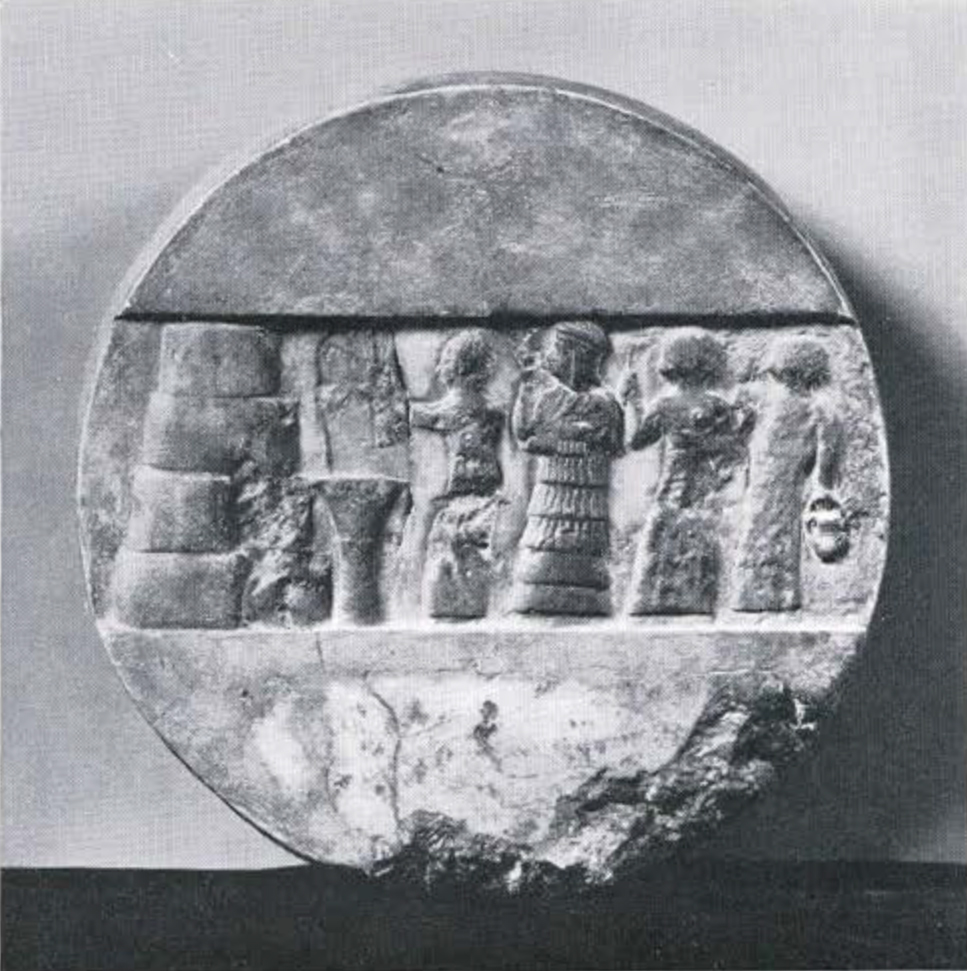 Disc with a carved in relief a scene of sacrifice