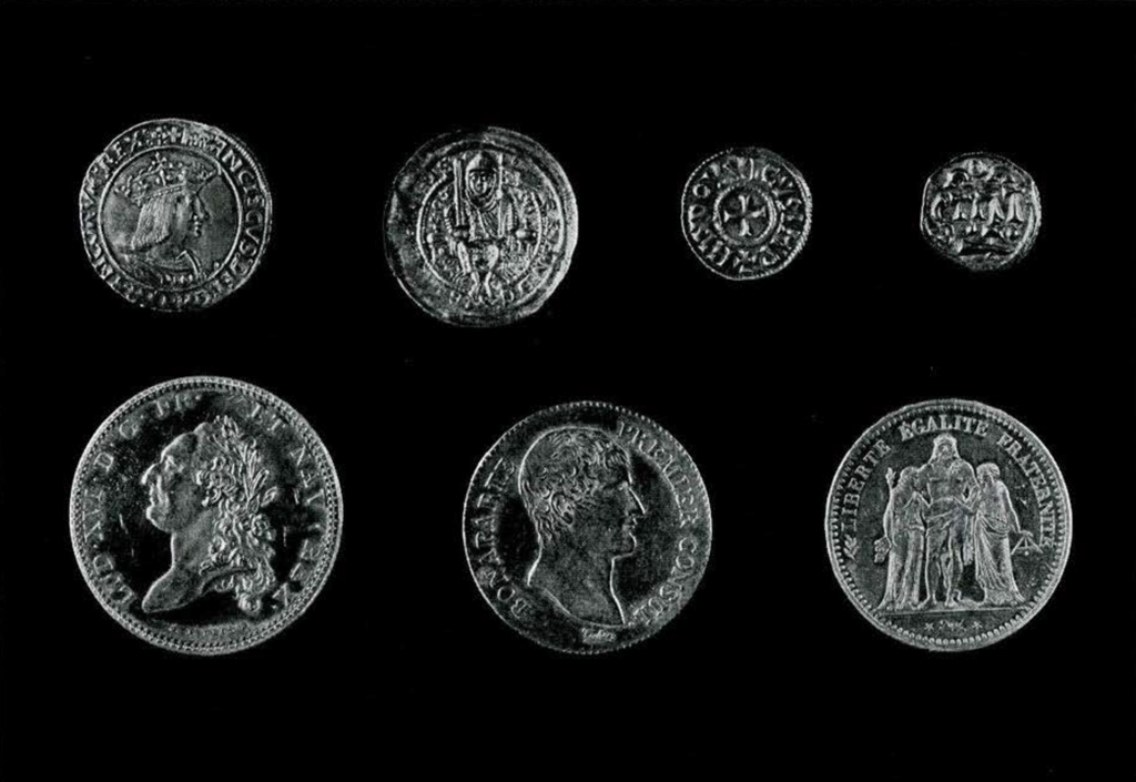 Seven French coins depicting various French rules