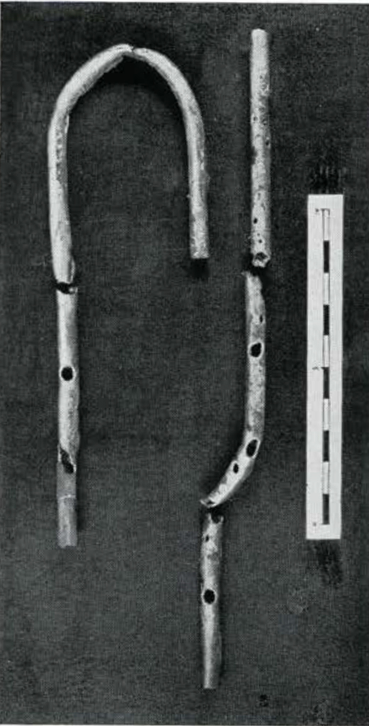 A cane or hook shaped flute in pieces, and other miscellaneous pieces